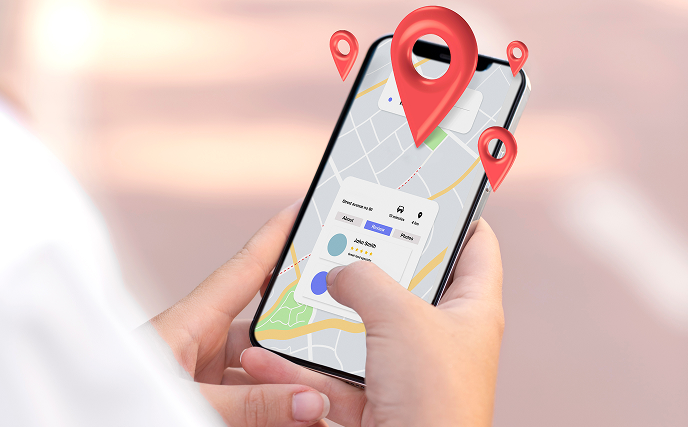 Hands holding smartphone with a bus in the background